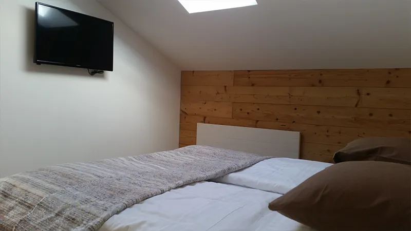 Bett im Zimmer Angelina